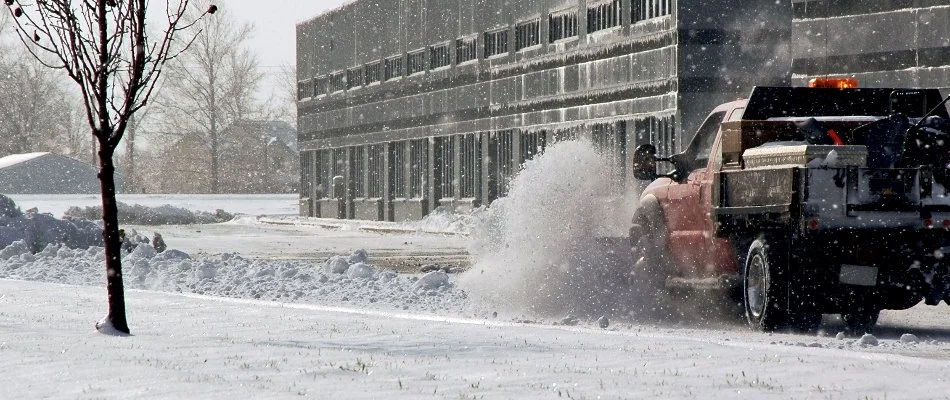 Plow truck clearing snow outside a commercial building in Lititz, PA.
