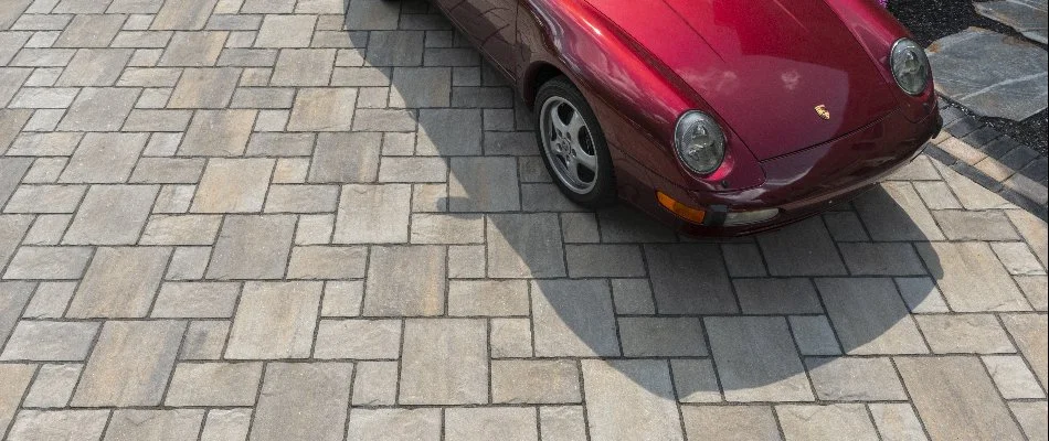Red car on a paver driveway in Lititz, PA.