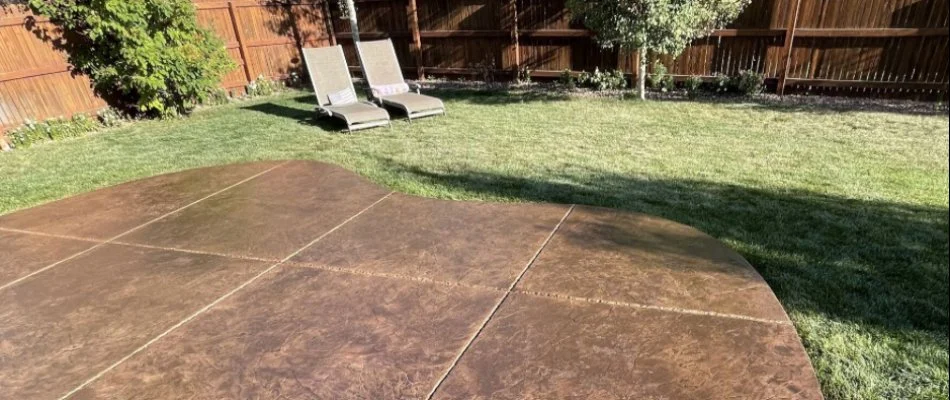 Backyard lawn in Cornwall, PA, with a patio.