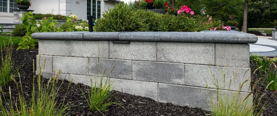 Block retaining wall in a mulched bed in Akron, PA.
