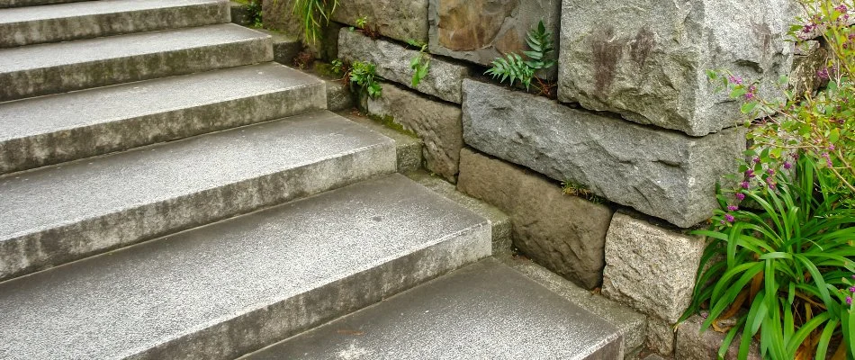 Concrete outdoor steps in Lititz, PA, next to a retaining wall.