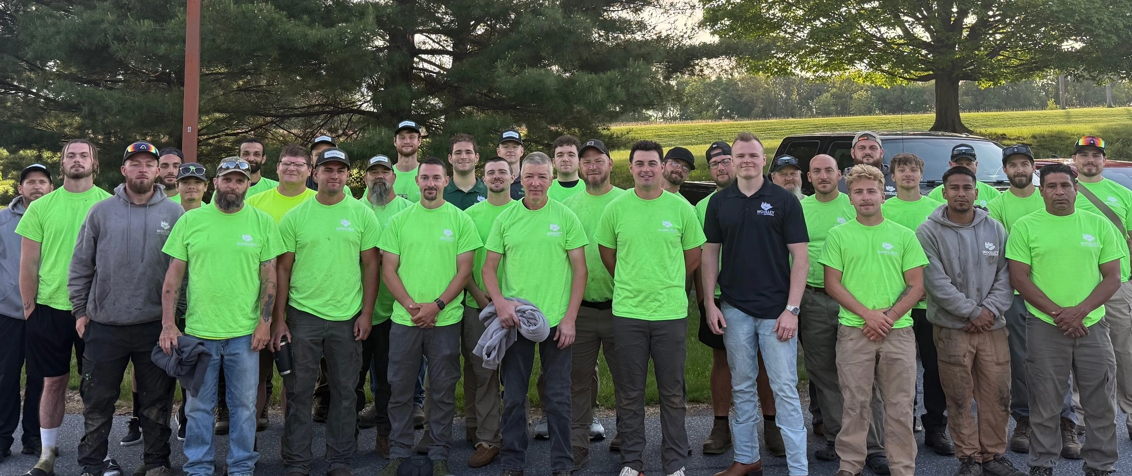 Team Photo With Green Woolley Outdoors Uniform