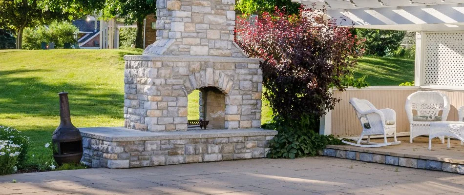 Lawn and plants around an outdoor fireplace in Lititz, PA.