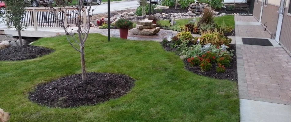 Lush grass and mulched landscape beds in Reamstown, PA.