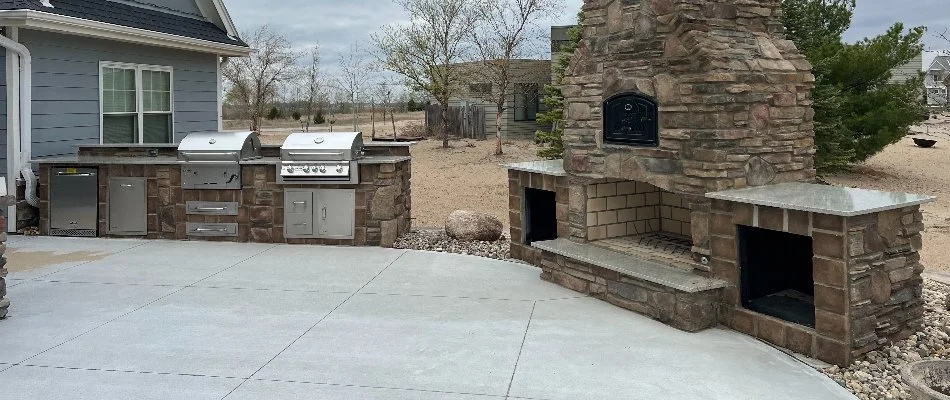 Outdoor fireplace next to an outdoor kitchen in Reamstown, PA.