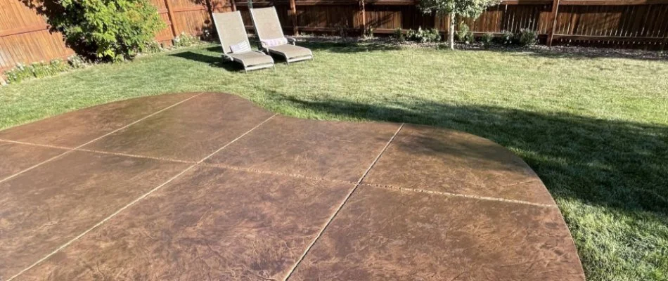 Patio in yard with two chairs in grass in Shiloh, PA.