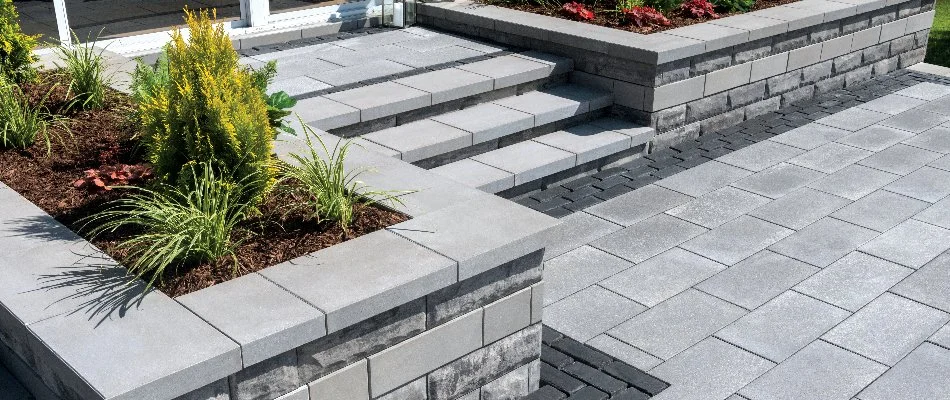 Retaining wall lining steps from a patio in Hershey, PA.