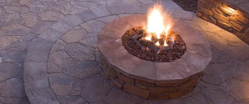Round fire pit on a patio in White Oak, PA.