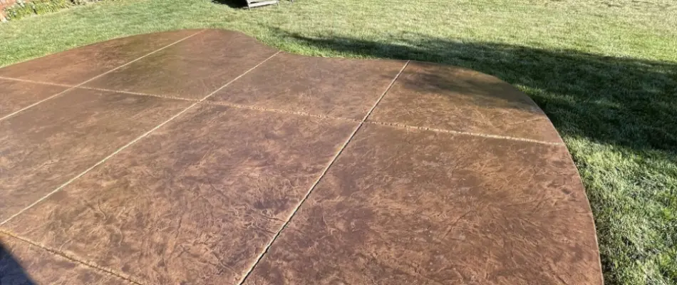 Stone patio in Middletown, PA, next to a lawn.